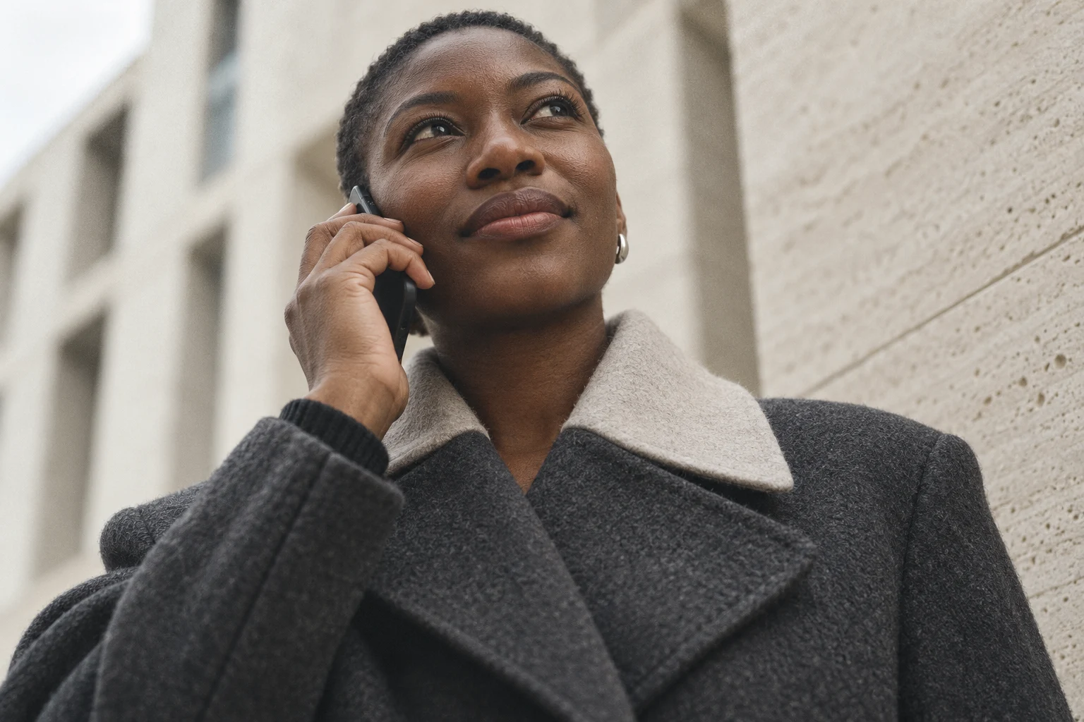 A woman taking a phone call on a city street